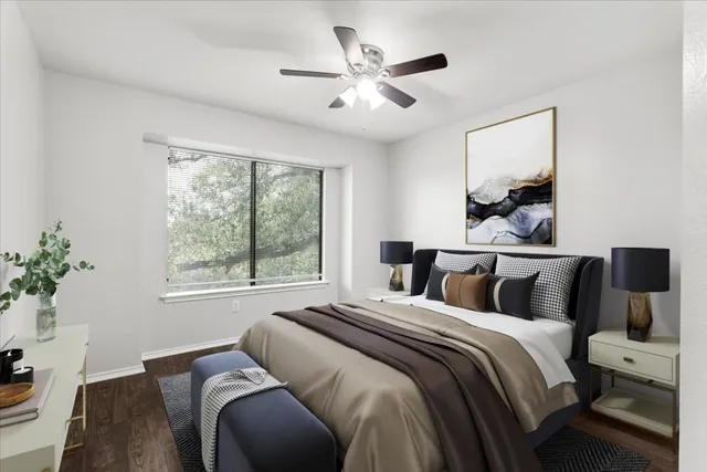 a bedroom with a large bed and a window