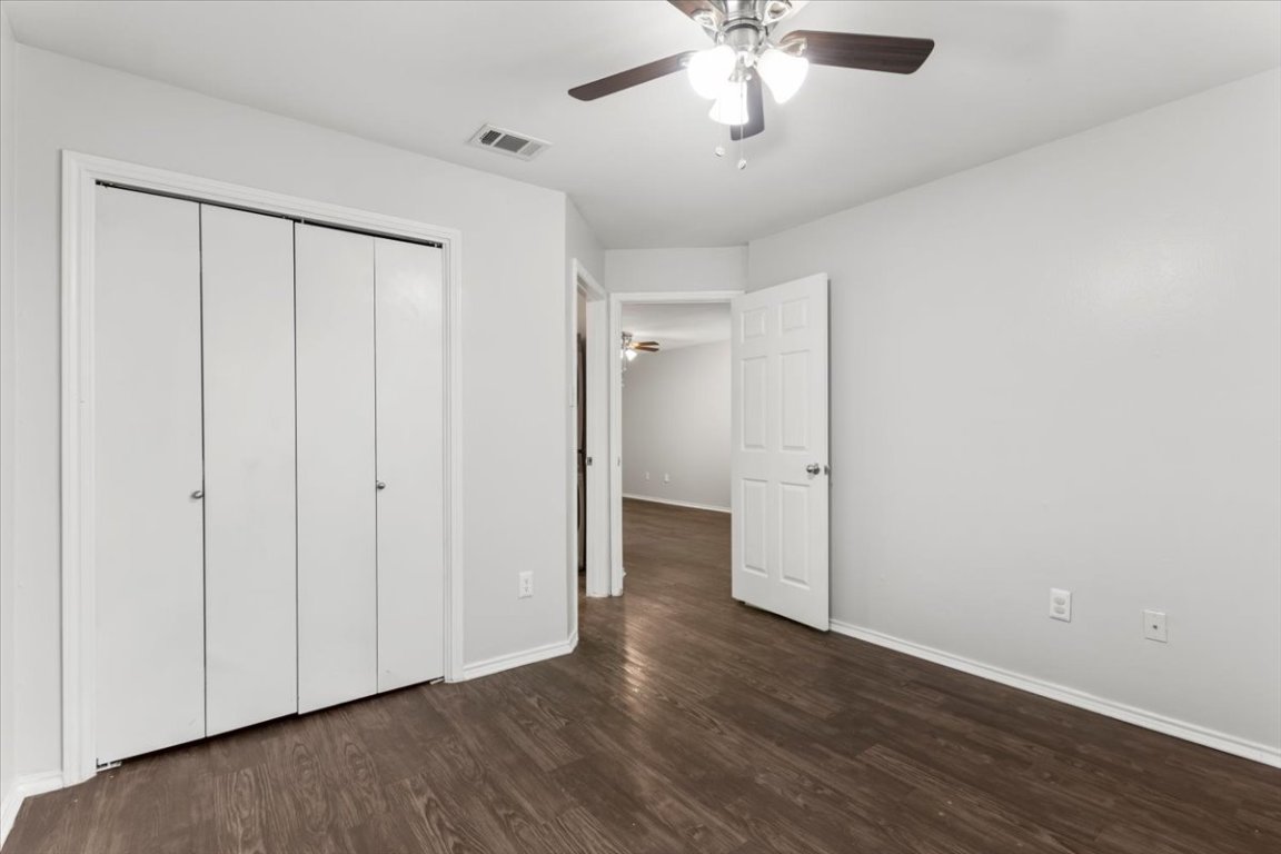 1740 Timber Ridge Road, Unit 132 Austin, TX 78741 - Photo 15 of 29 wooden floor in an empty room