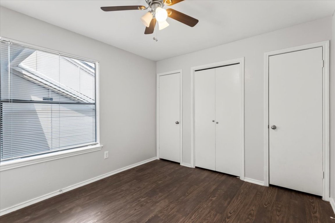 1740 Timber Ridge Road, Unit 132 Austin, TX 78741 - Photo 18 of 29 a view of an empty room with wooden floor and a window