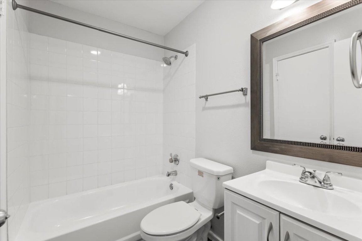 1740 Timber Ridge Road, Unit 132 Austin, TX 78741 - Photo 20 of 29 a bathroom with a sink toilet and shower