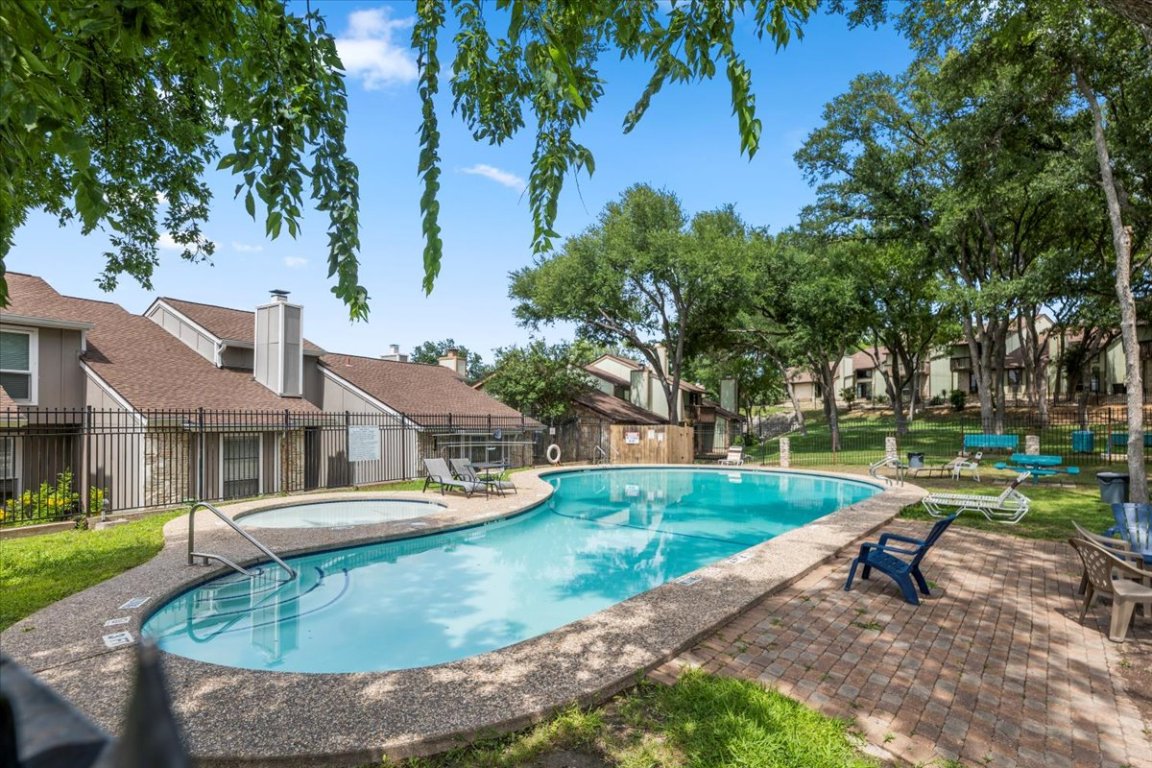 1740 Timber Ridge Road, Unit 132 Austin, TX 78741 - Photo 25 of 29 front view of a house with a yard