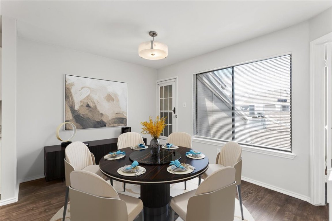 1740 Timber Ridge Road, Unit 132 Austin, TX 78741 - Photo 9 of 29 a dining room with furniture a window and wooden floor