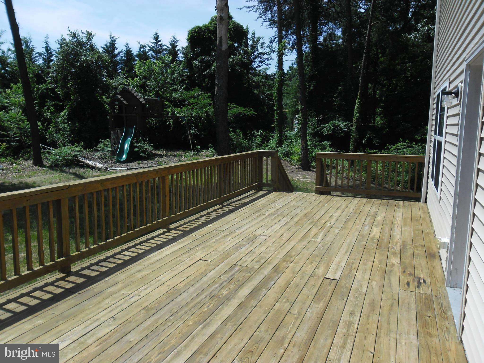 7833 Clark Station Road Severn, MD 21144 - Photo 12 of 30 a balcony with view of trees in the background