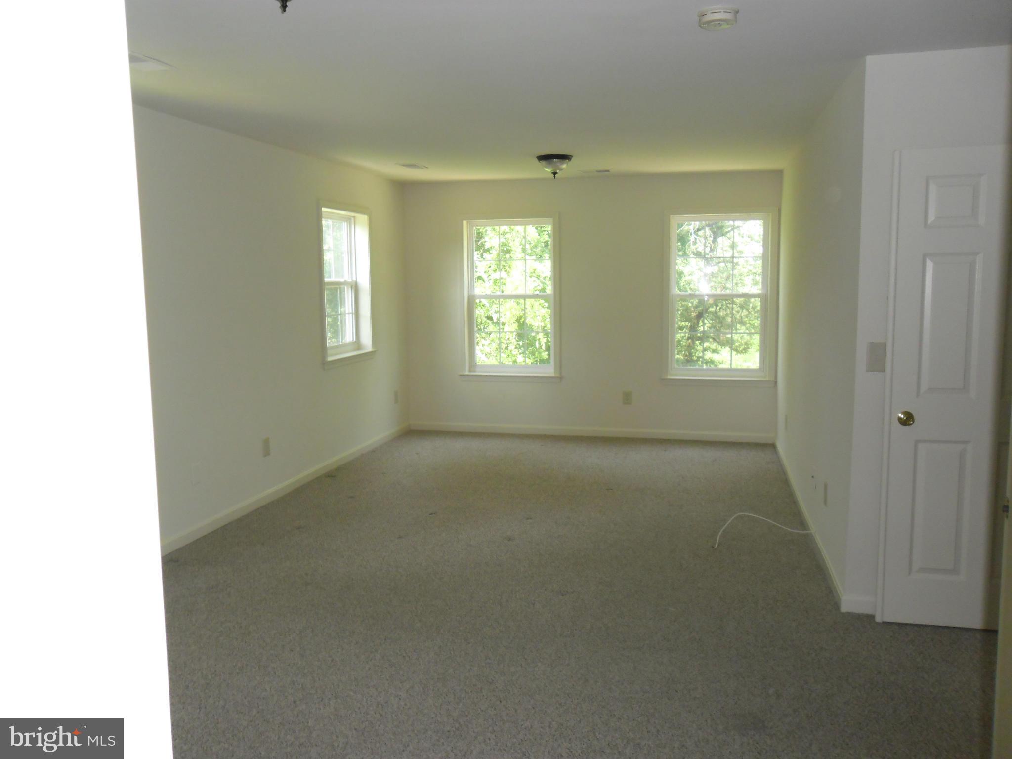 7833 Clark Station Road Severn, MD 21144 - Photo 14 of 30 a view of an empty room with a window