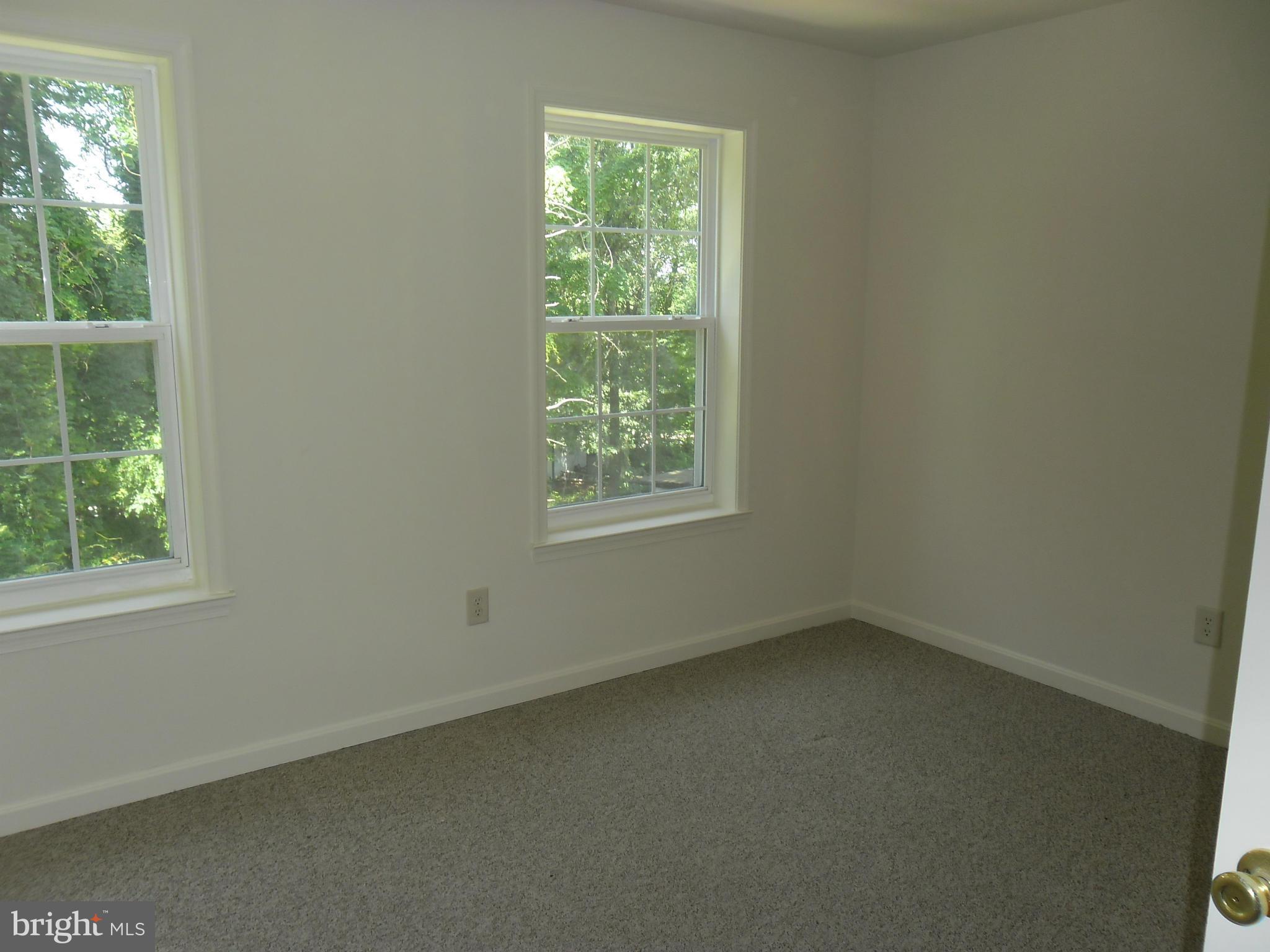 7833 Clark Station Road Severn, MD 21144 - Photo 16 of 30 an empty room with a window