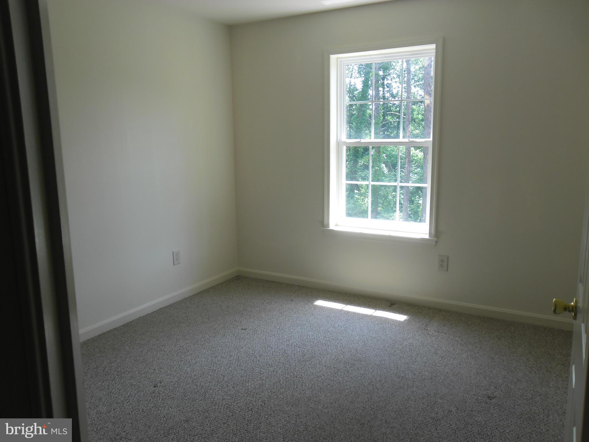 7833 Clark Station Road Severn, MD 21144 - Photo 17 of 30 an empty room with a window