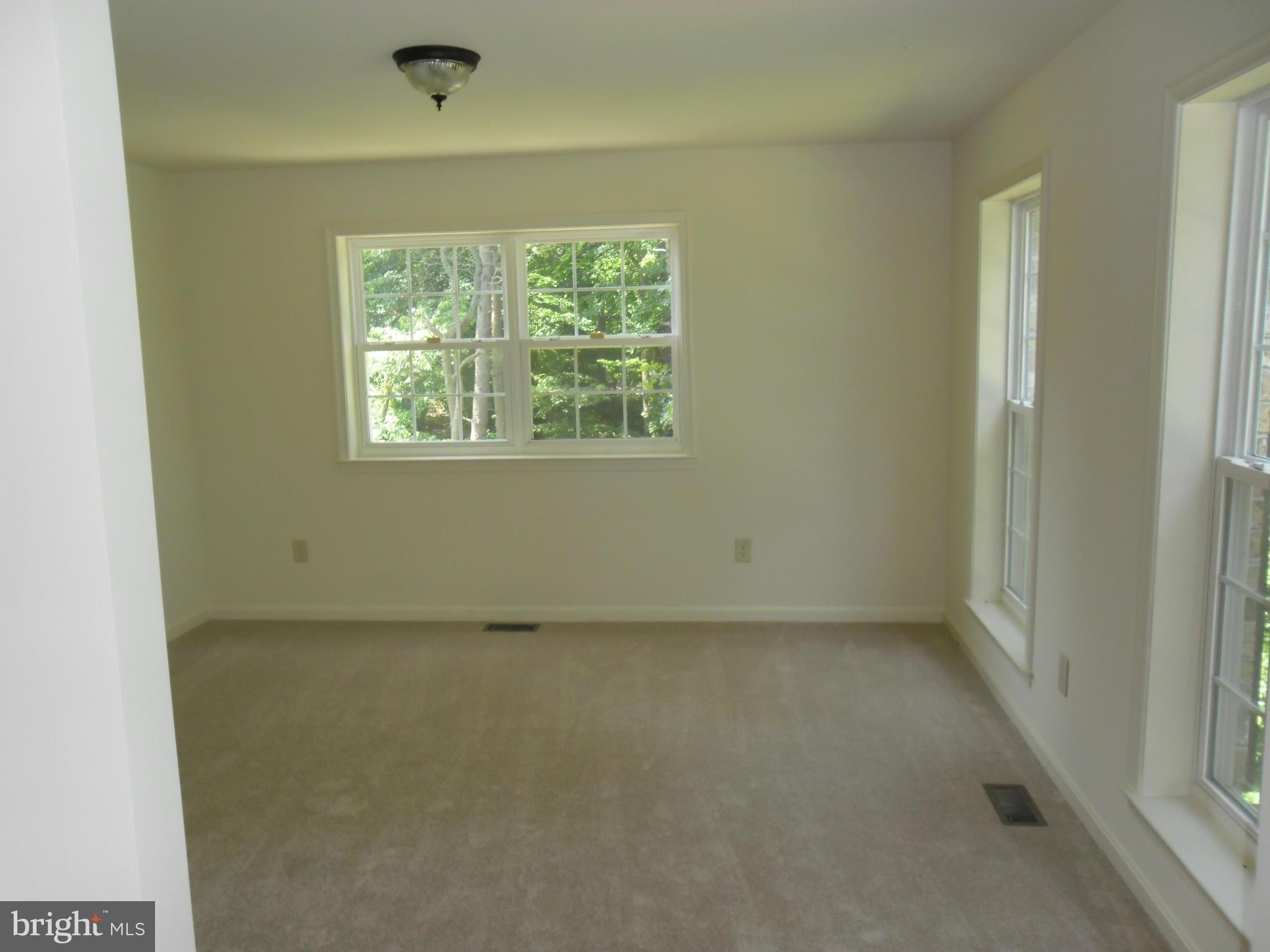 7833 Clark Station Road Severn, MD 21144 - Photo 21 of 30 an empty room with a window