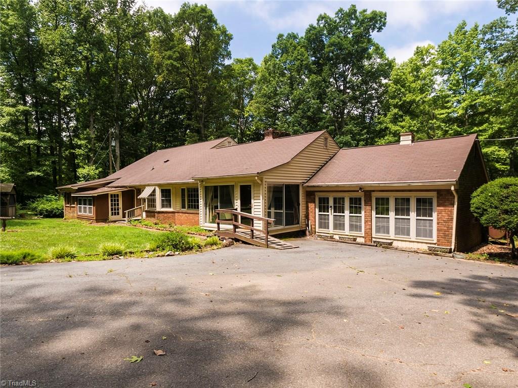 1812 Neelley Road Pleasant Garden, NC 27313 - Photo 3 of 26 The back of the home shows all the great windows and just how much space is truly in this home! Section on the right is Bonus room that was converted from a 2 car garge. It can be converted back if you like