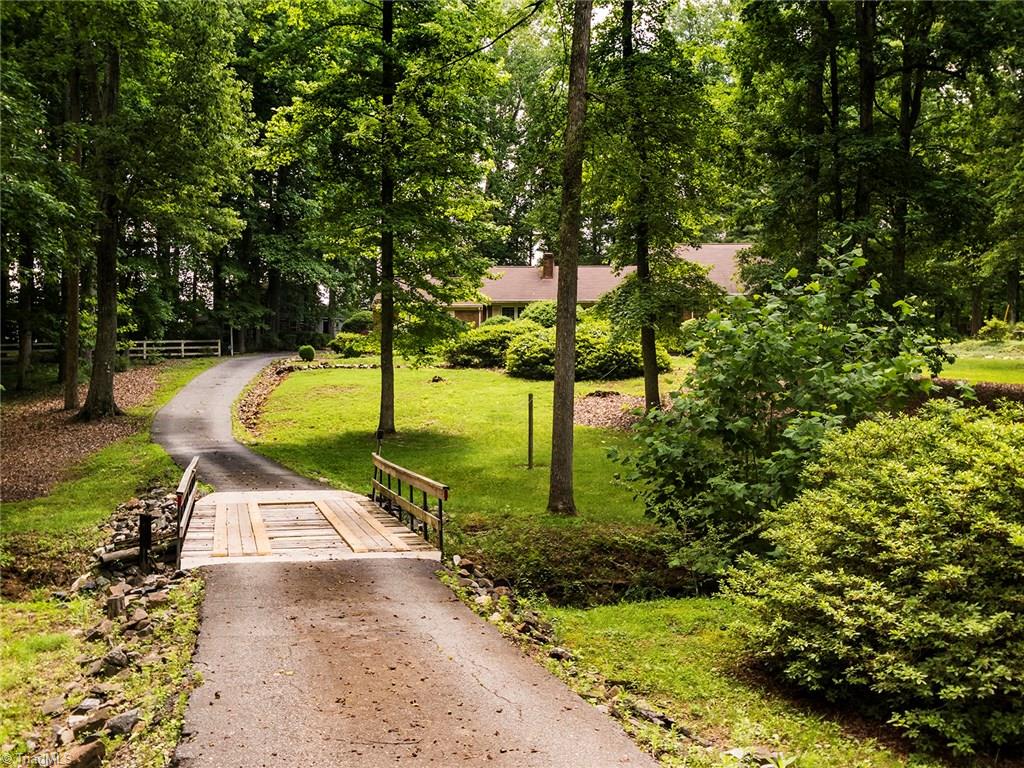 1812 Neelley Road Pleasant Garden, NC 27313 - Photo 8 of 26 This lovely home is situated back off the road with a paved driveway.