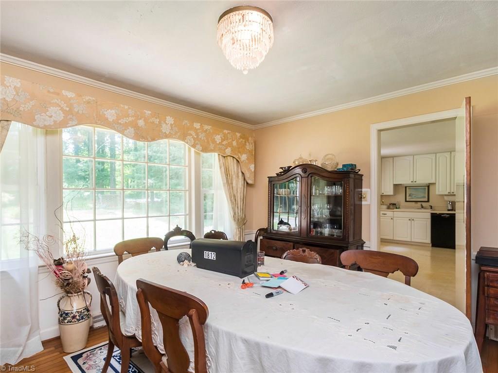 1812 Neelley Road Pleasant Garden, NC 27313 - Photo 9 of 26 The dining room is perfect for formal dinners situated off the main living areas of the home.