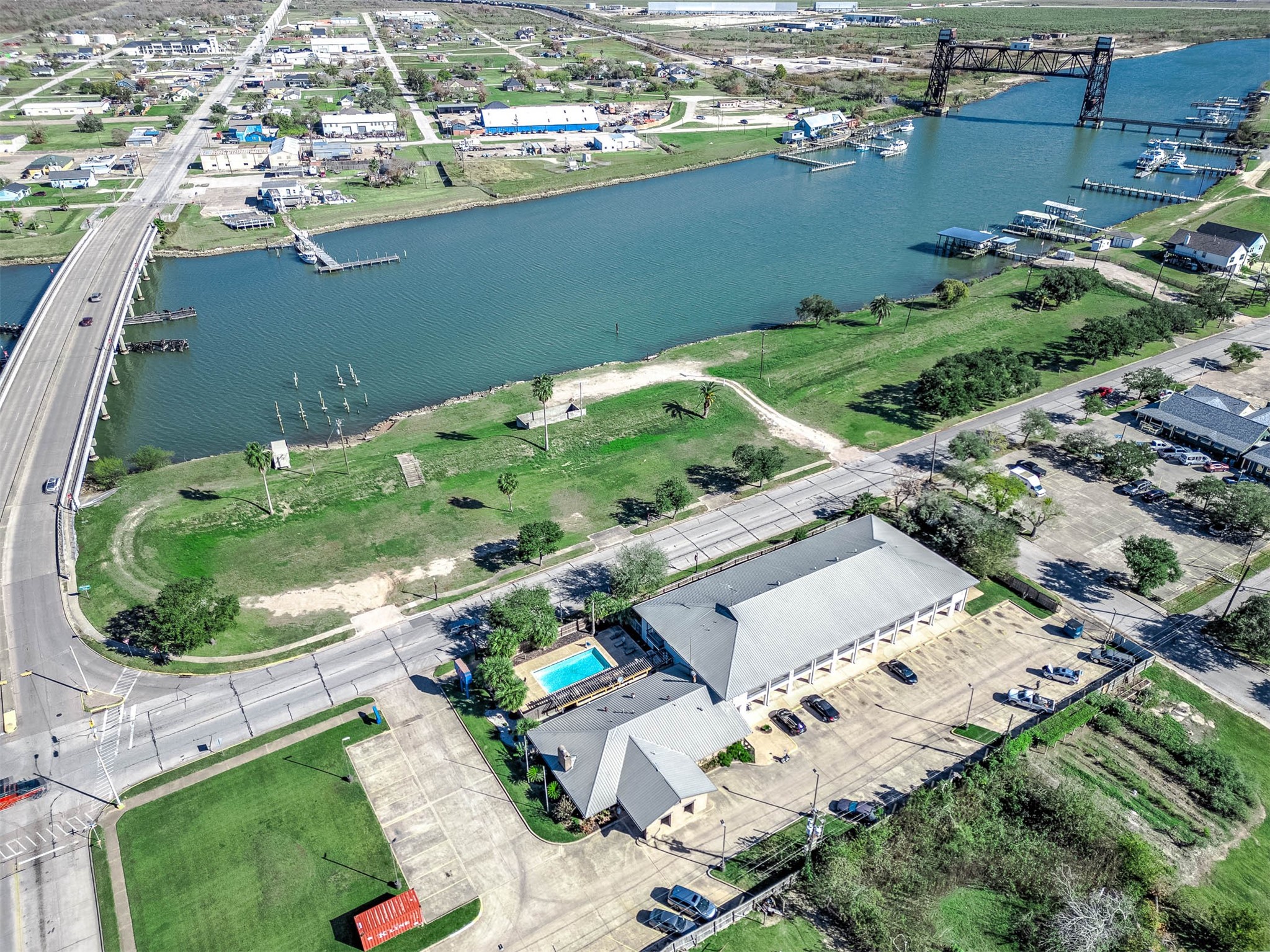 1024 West 2nd Street Freeport, TX 77541 - Photo 2 of 9 an aerial view of a house with a yard and lake view