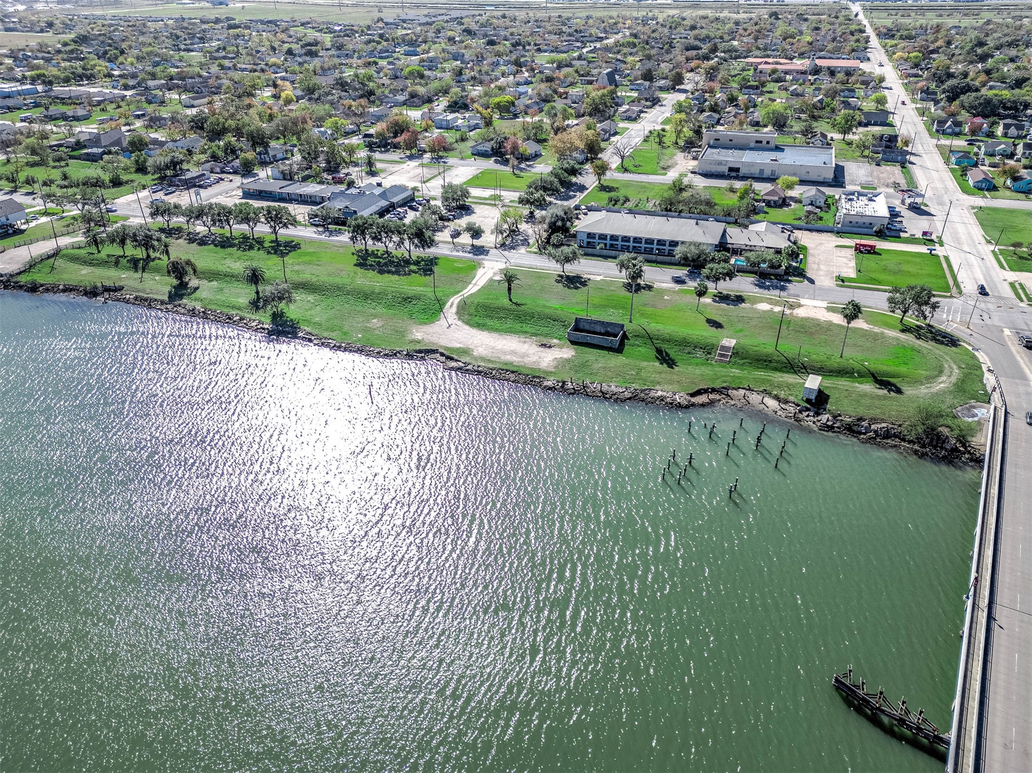 1024 West 2nd Street Freeport, TX 77541 - Photo 7 of 9 an aerial view of a house with a yard and lake view
