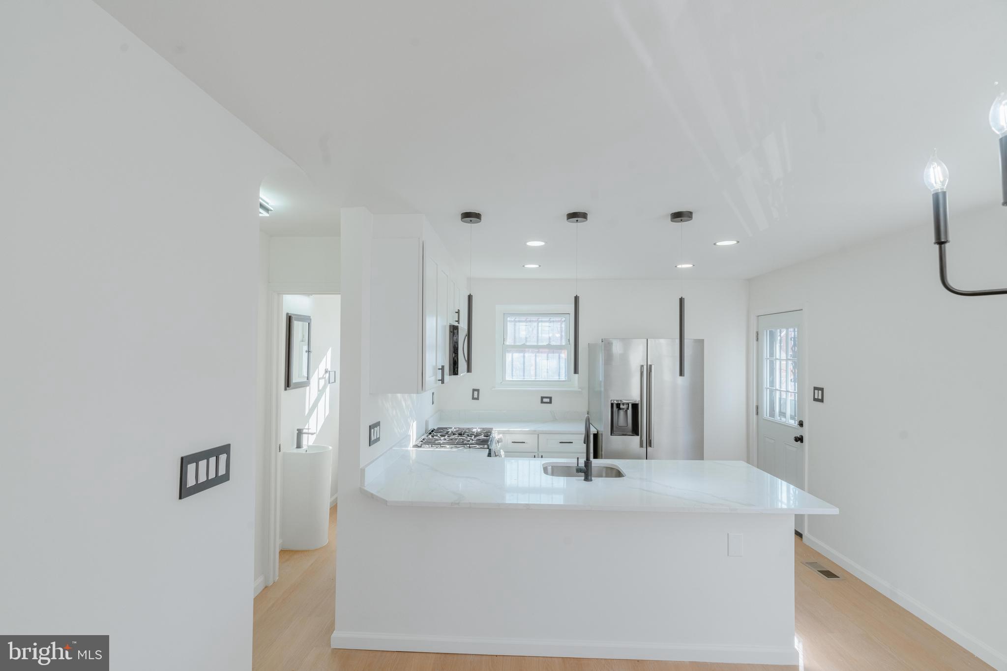 413 Kennedy Street Northeast Washington, DC 20011 - Photo 15 of 16 a view of a bathroom with sink shower and mirror
