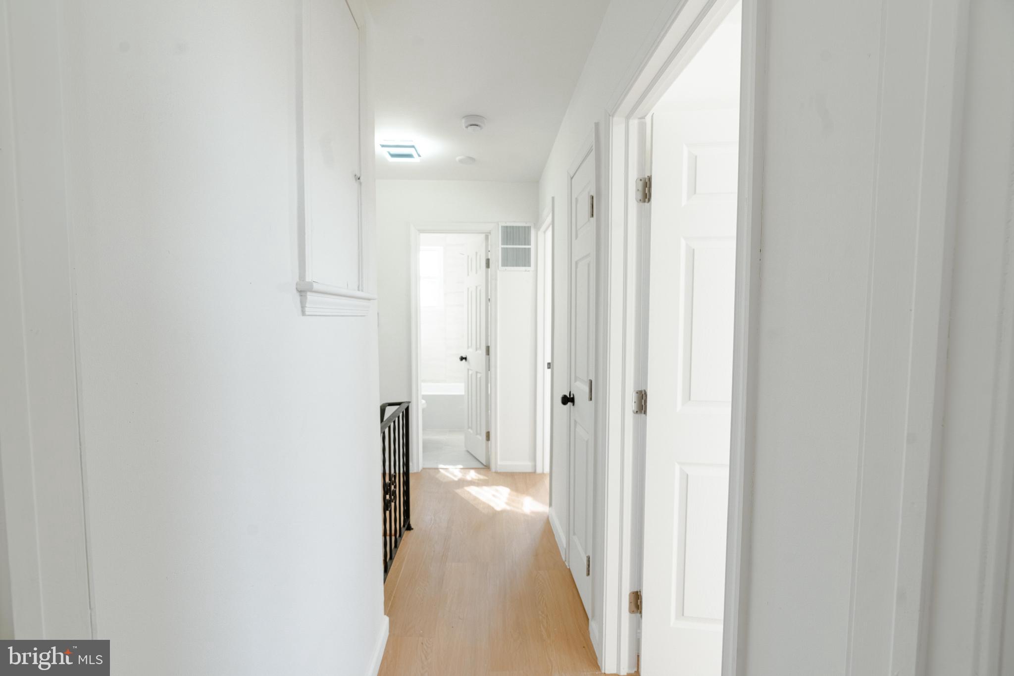 413 Kennedy Street Northeast Washington, DC 20011 - Photo 10 of 16 a view of a hallway with wooden floor