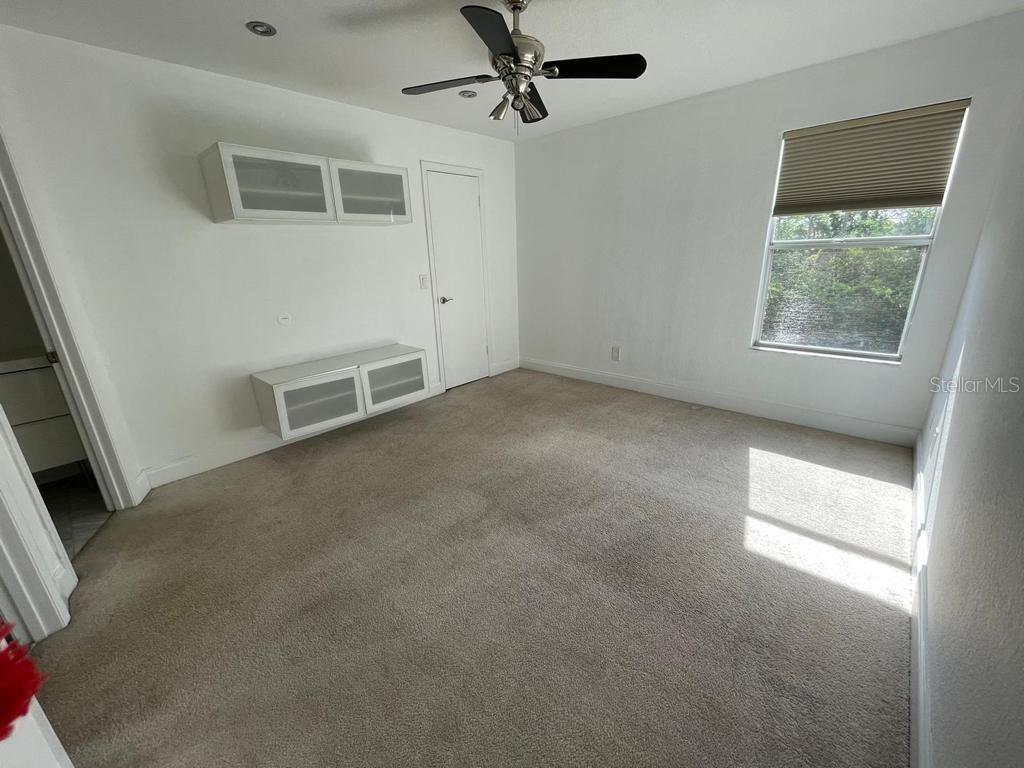5140 Conroy Road, Unit 37 Orlando, FL 32811 - Photo 14 of 18 an empty room with windows