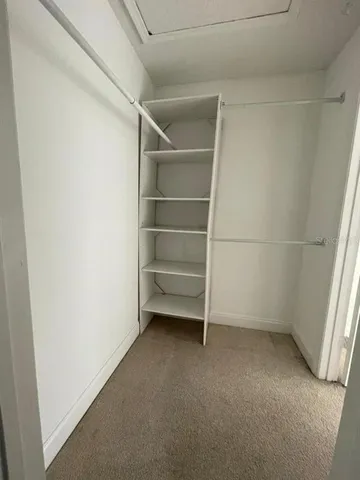 a view of an empty walk in closet