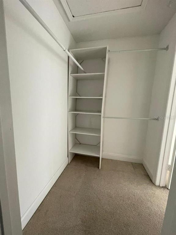 5140 Conroy Road, Unit 37 Orlando, FL 32811 - Photo 15 of 18 a view of an empty walk in closet