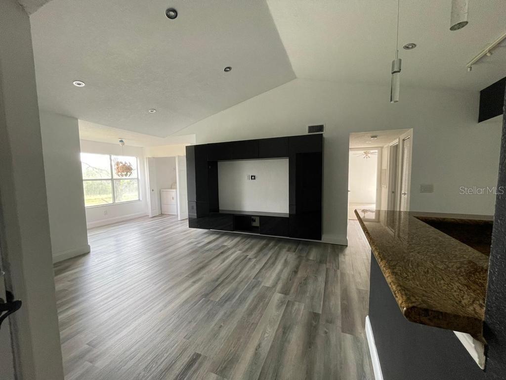 5140 Conroy Road, Unit 37 Orlando, FL 32811 - Photo 2 of 18 a view of livingroom with furniture and wooden floor