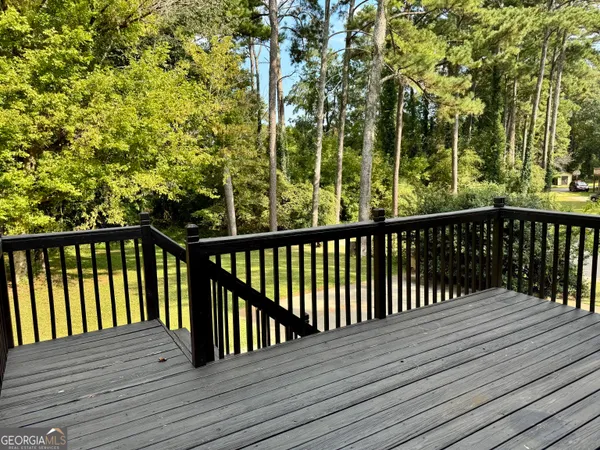 a view of balcony with wooden floor