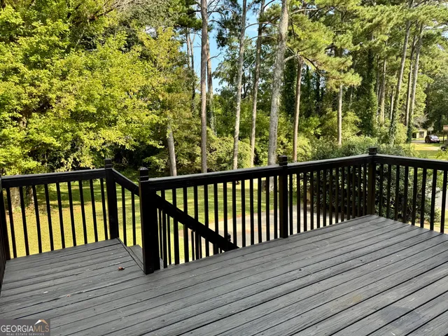 a view of balcony with wooden floor