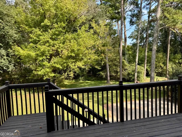 a view of balcony with wooden floor
