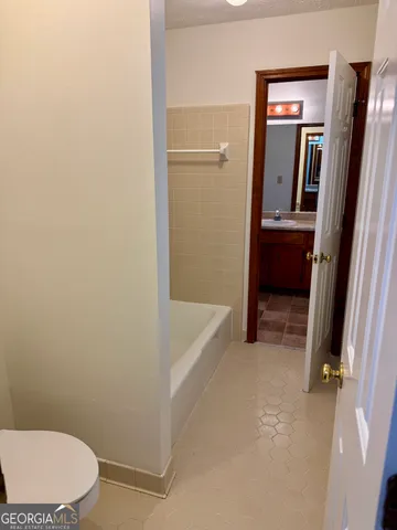 a bathroom with a sink and toilet