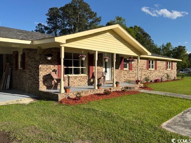 538 County Rd S-22-537 Georgetown, SC 29440 - Photo 1 of 36 Ranch-style house featuring a porch, a front lawn,