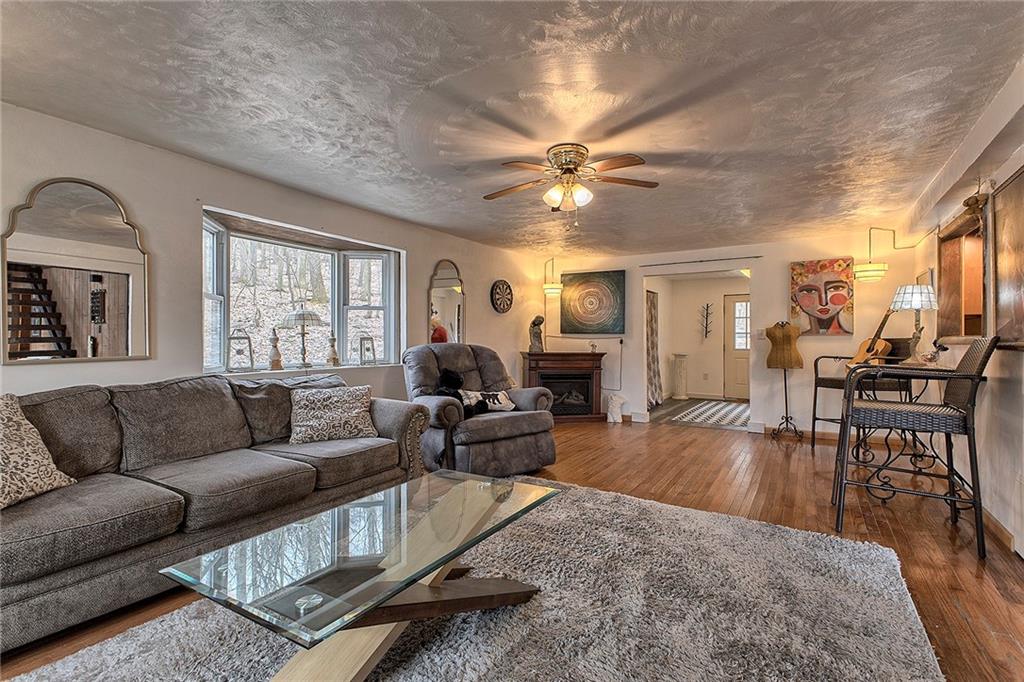240 Birch Road Acme, PA 15610 - Photo 18 of 44 a living room with furniture and a large window