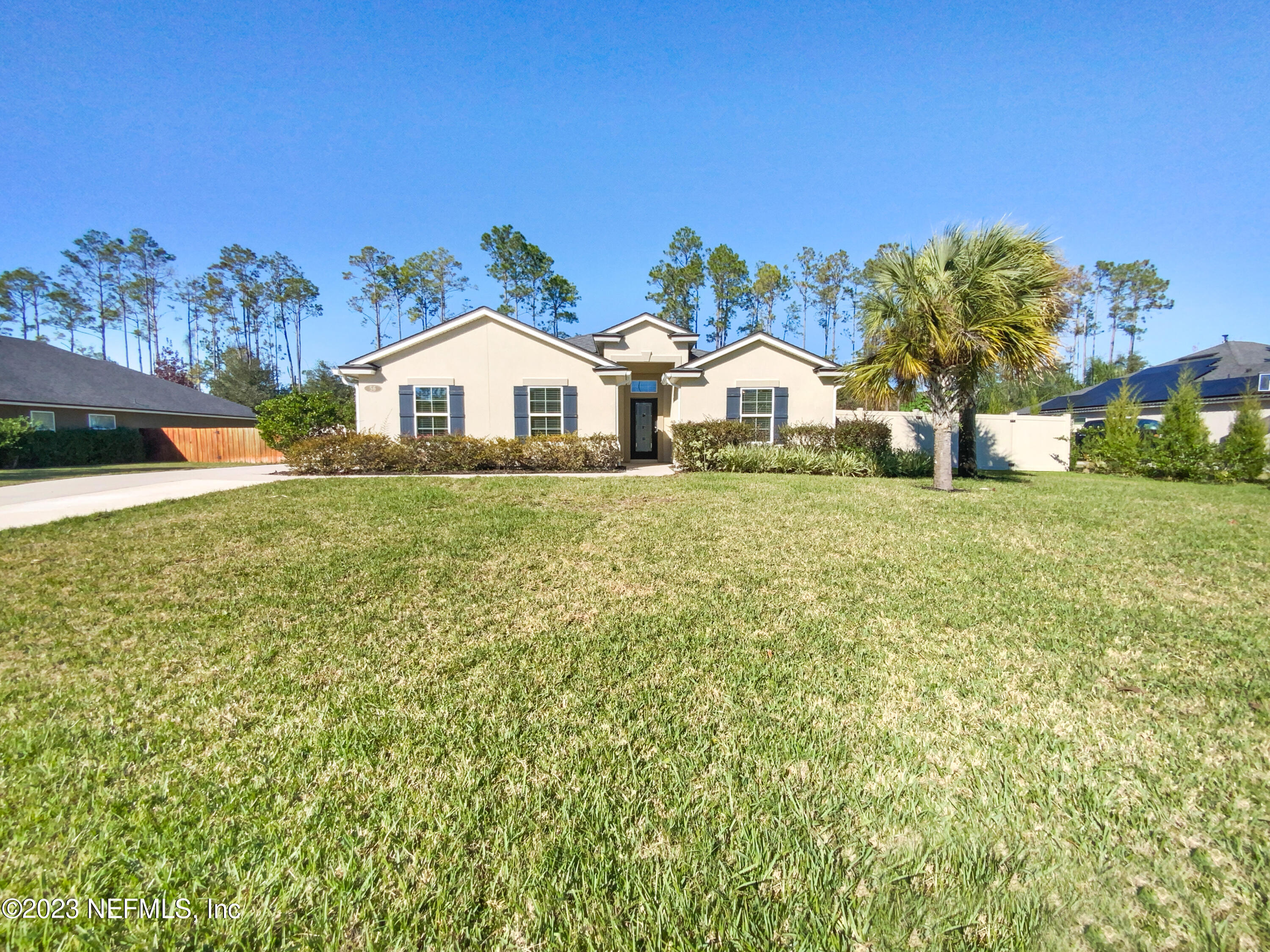 56 Irish Rose Road St. Augustine, FL 32092 - Photo 1 of 25 a front view of a house with a yard