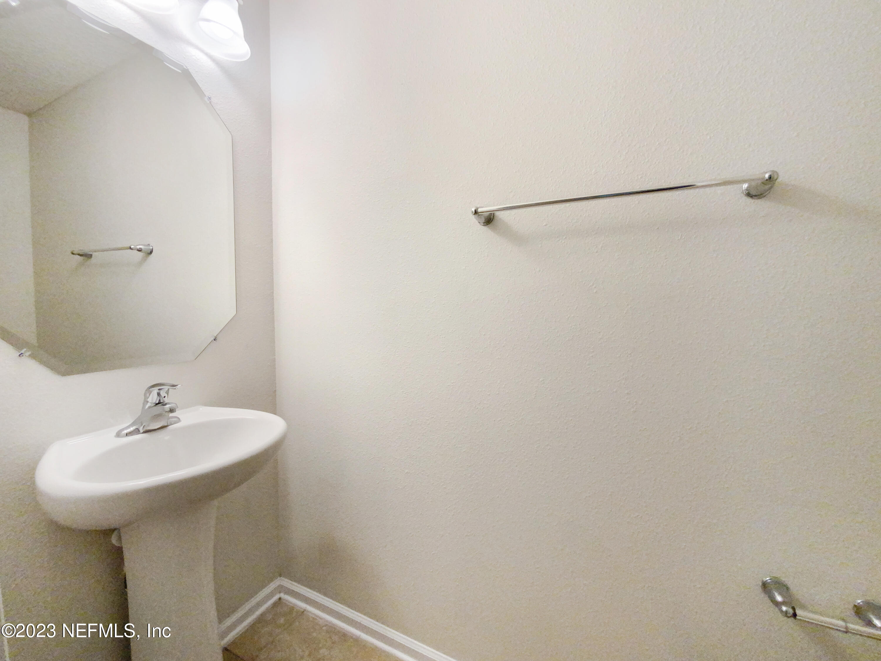 56 Irish Rose Road St. Augustine, FL 32092 - Photo 15 of 25 a bathroom with a sink and mirror