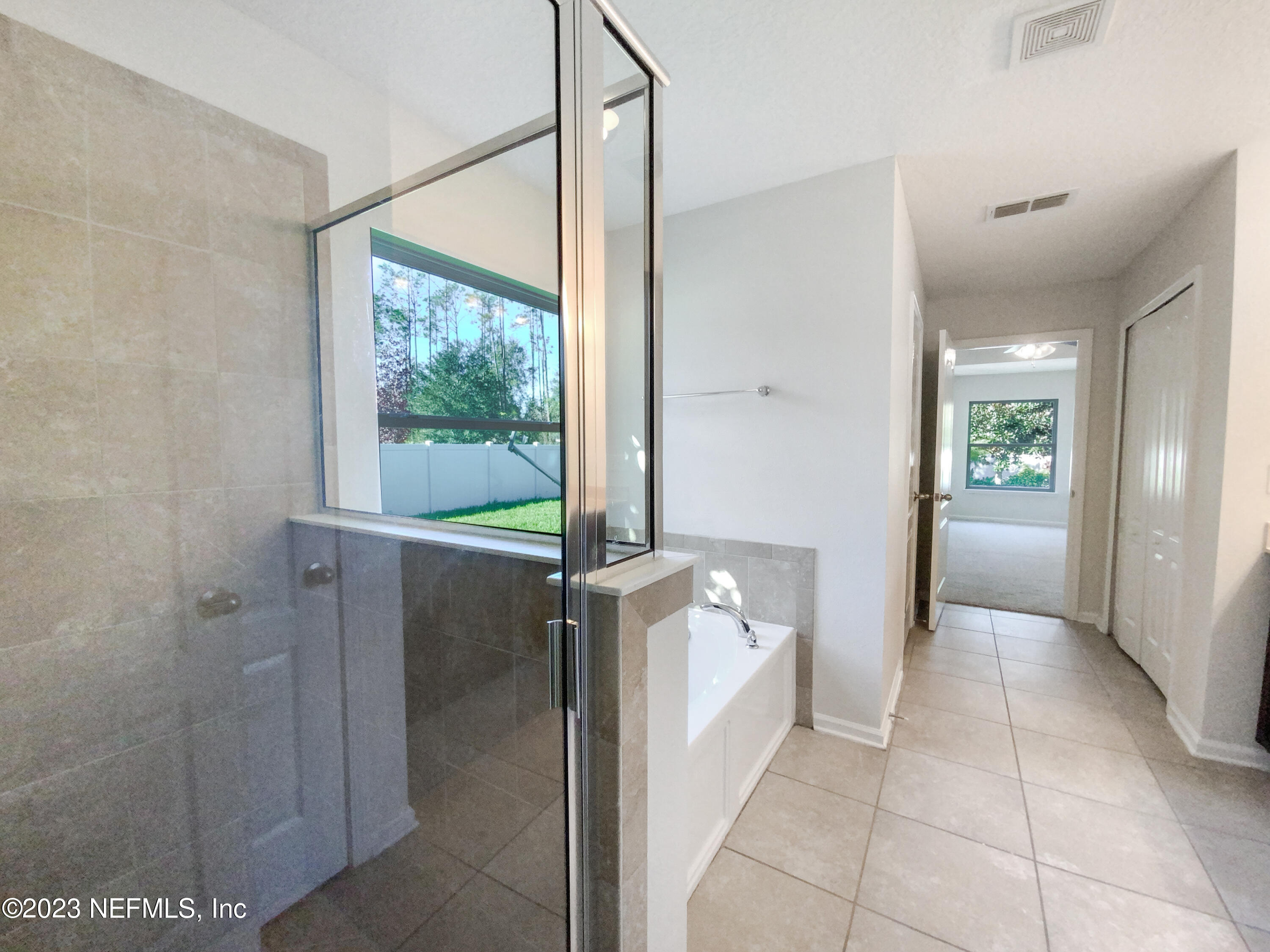 56 Irish Rose Road St. Augustine, FL 32092 - Photo 20 of 25 a view of a walk in closet and bathroom
