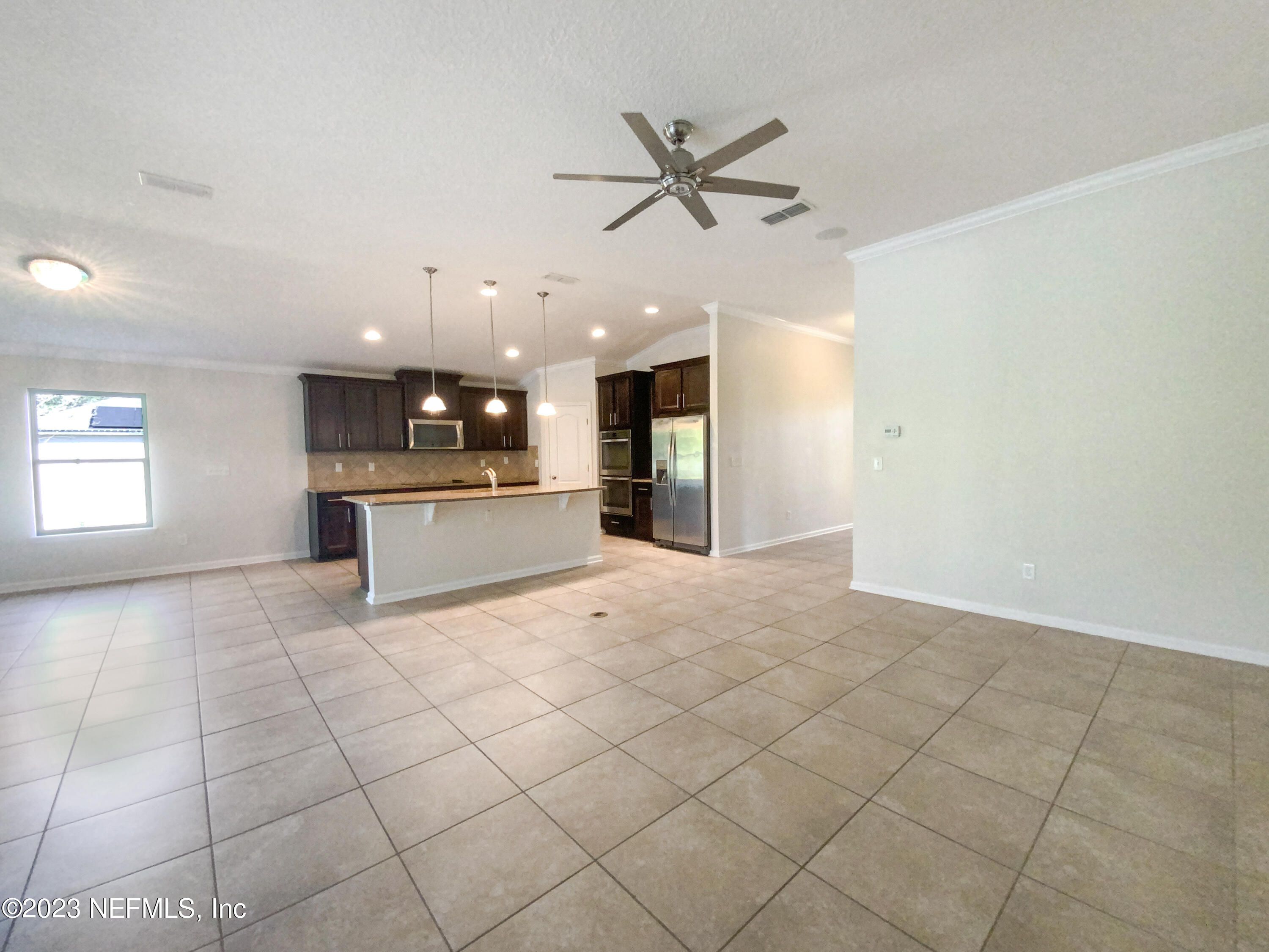 56 Irish Rose Road St. Augustine, FL 32092 - Photo 3 of 25 a view of a kitchen with a sink and a window