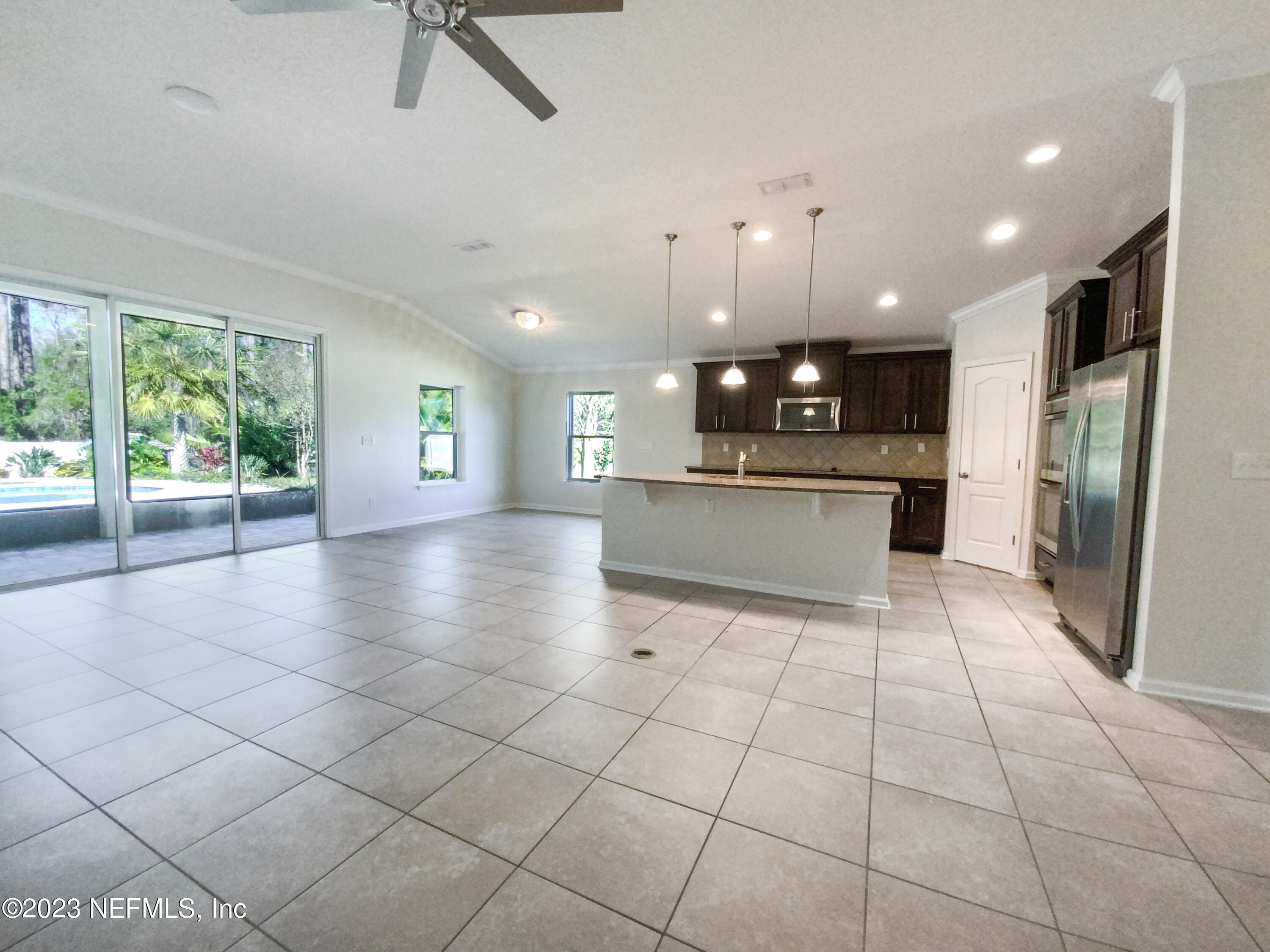 56 Irish Rose Road St. Augustine, FL 32092 - Photo 8 of 25 a large kitchen with granite countertop a large counter top stainless steel appliances and cabinets