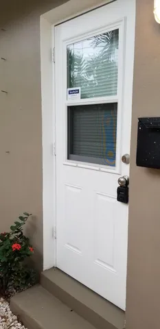 a utility room with wooden floor washer and dryer
