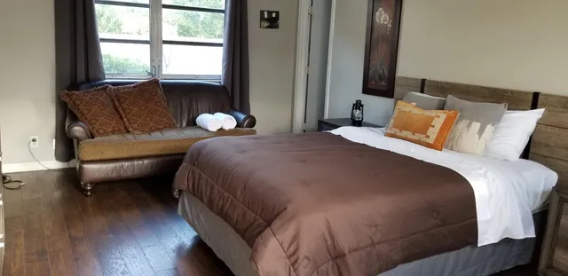 a bedroom with a bed and a dresser