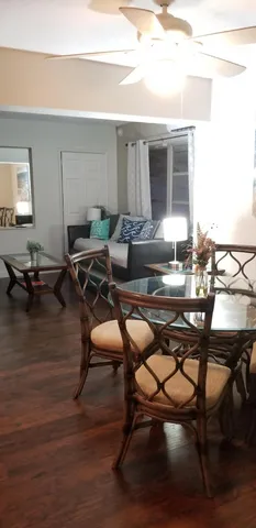 a work room with furniture and wooden floor