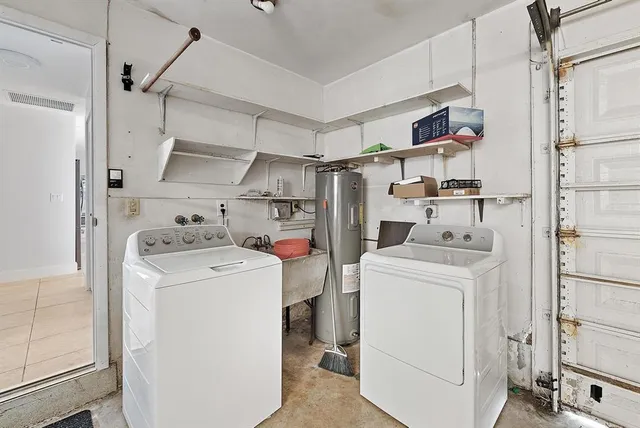 a view of storage and utility room with washer and dryer