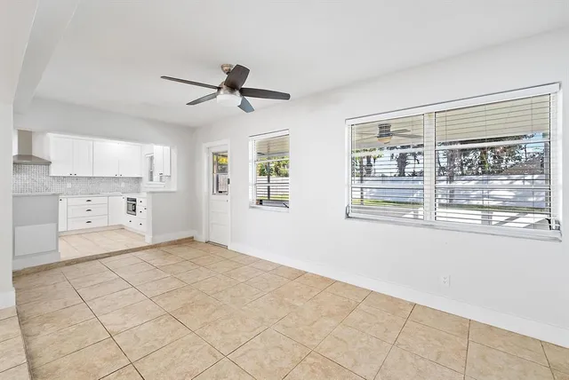 a view of a kitchen with furniture and windows