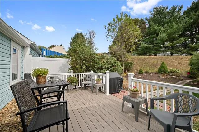 a view of a chairs and table on the balcony