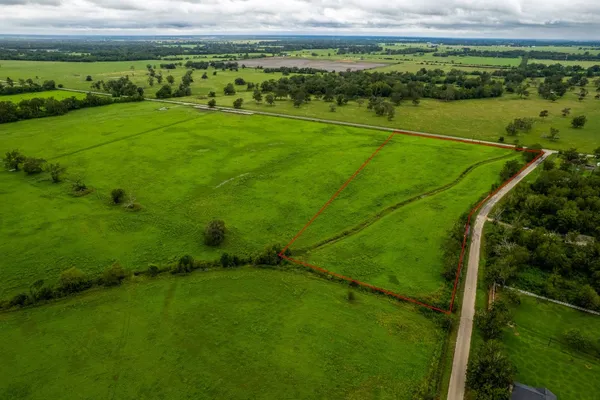 a view of a field with an outdoor space