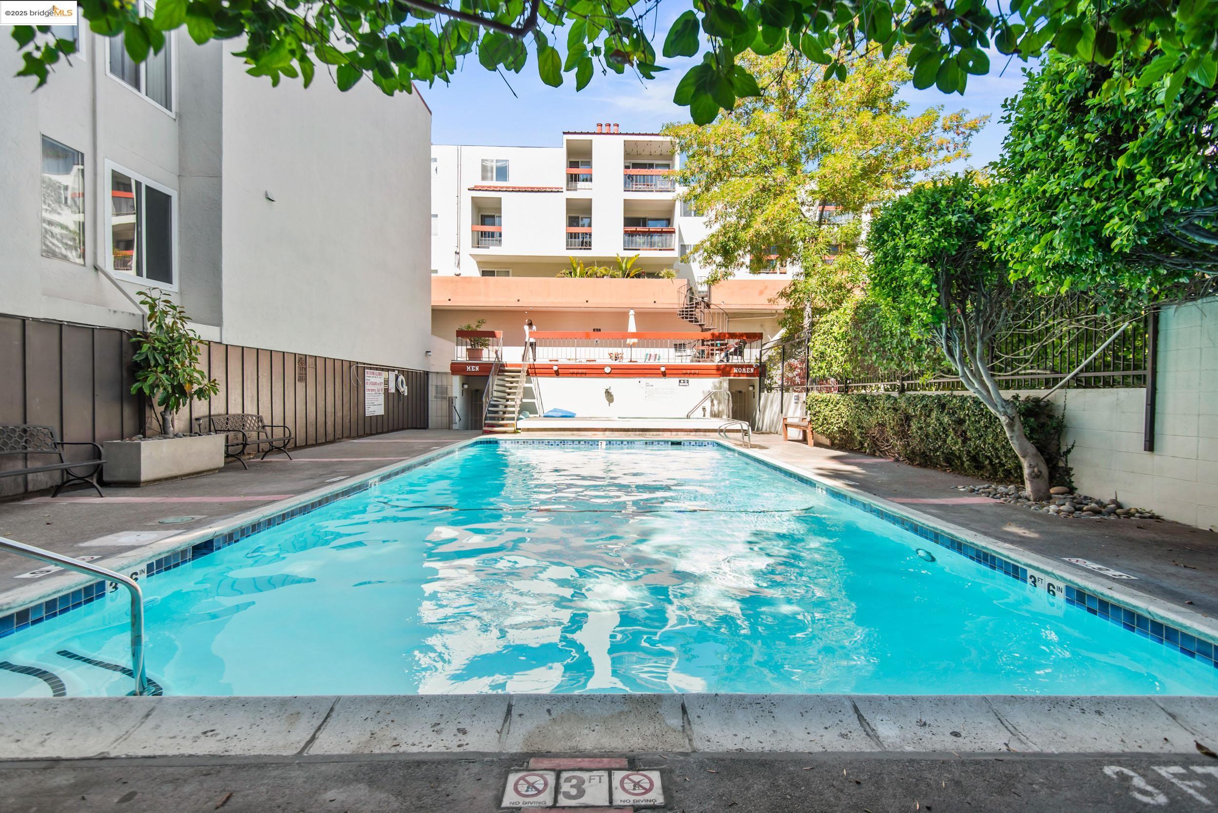 288 Whitmore Street, Unit 310B Oakland, CA 94611 - Photo 1 of 37 a view of a patio with table and chairs and wooden fence