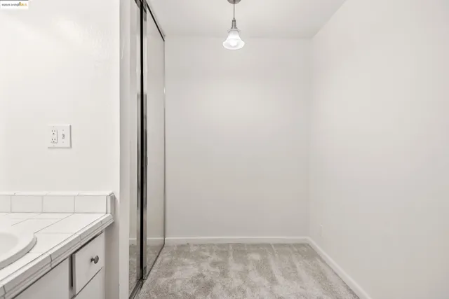a bathroom with a sink vanity and a mirror