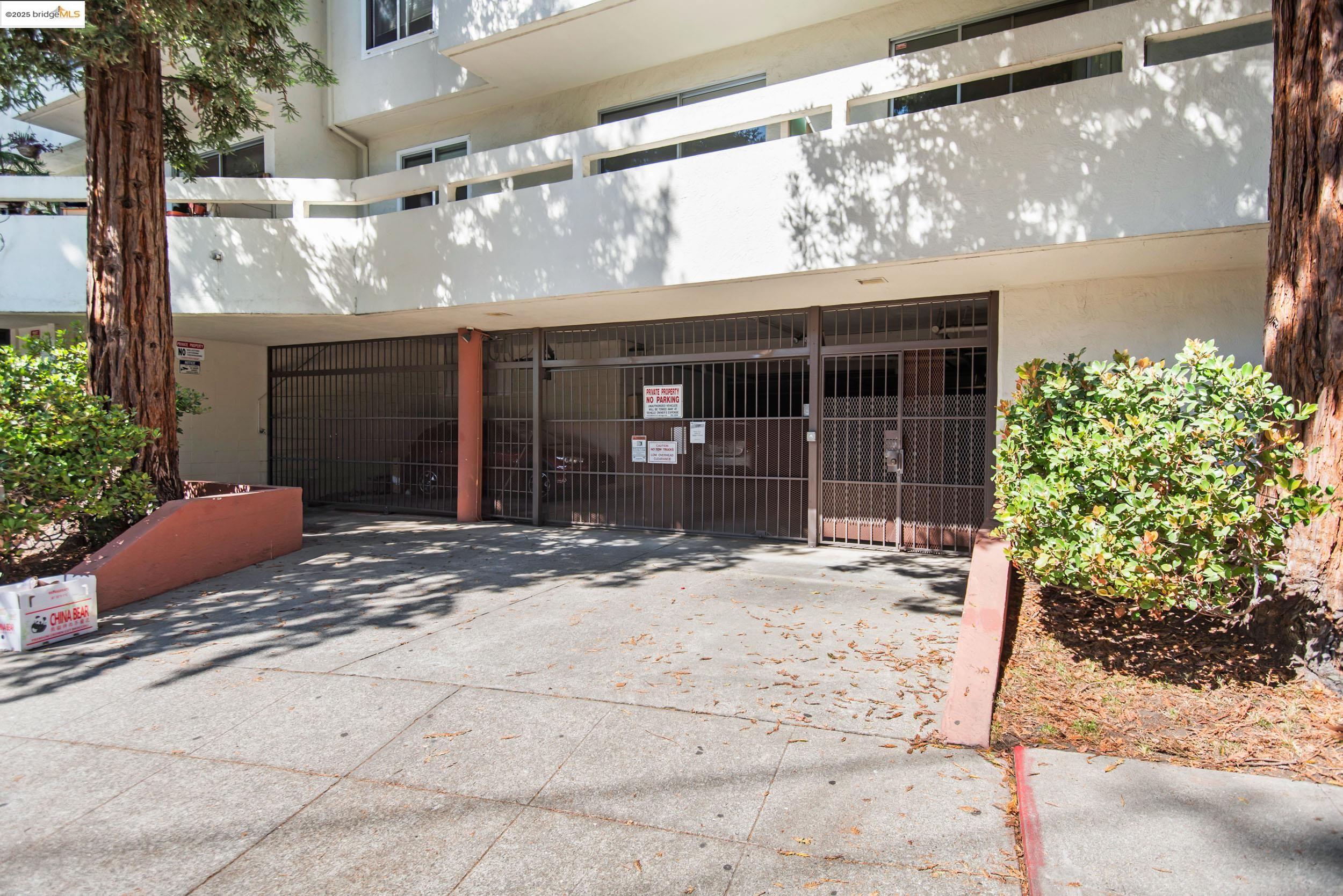 288 Whitmore Street, Unit 310B Oakland, CA 94611 - Photo 25 of 37 a front view of a house with a yard and garage