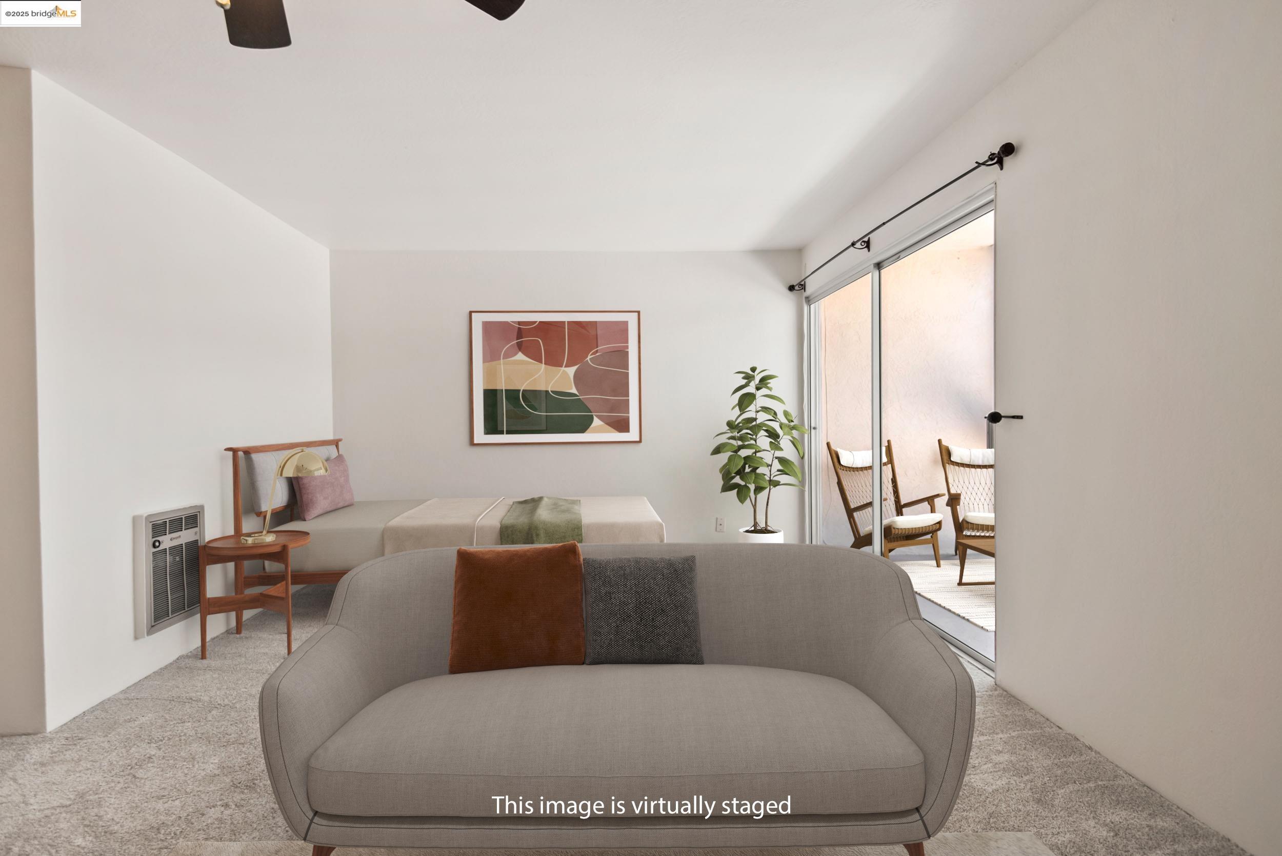 288 Whitmore Street, Unit 310B Oakland, CA 94611 - Photo 6 of 37 a living room with furniture and a potted plant