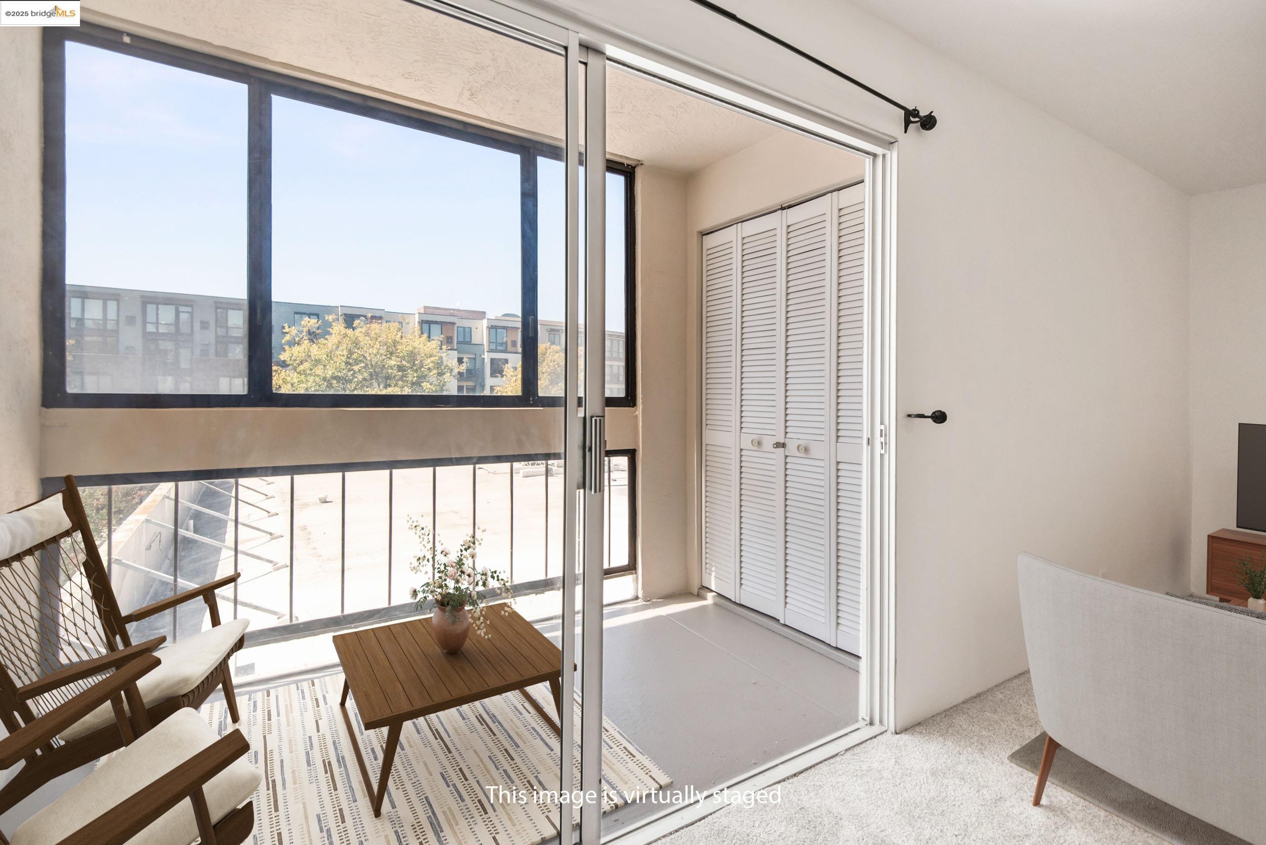 288 Whitmore Street, Unit 310B Oakland, CA 94611 - Photo 8 of 37 a living room with furniture and a large window