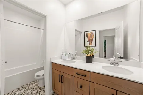 a bathroom with a shower curtain and a bathtub