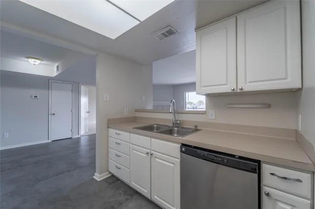 an empty room with floor to ceiling window and an empty room with a fireplace