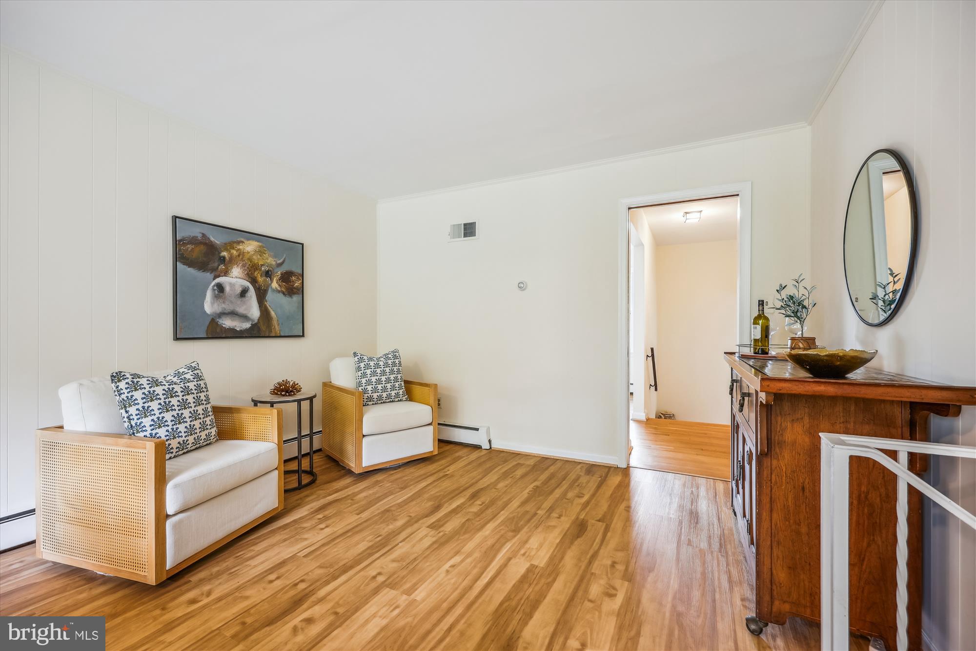 1029 Tracy Drive Silver Spring, MD 20904 - Photo 19 of 59 a living room with furniture a mirror and a wooden floor