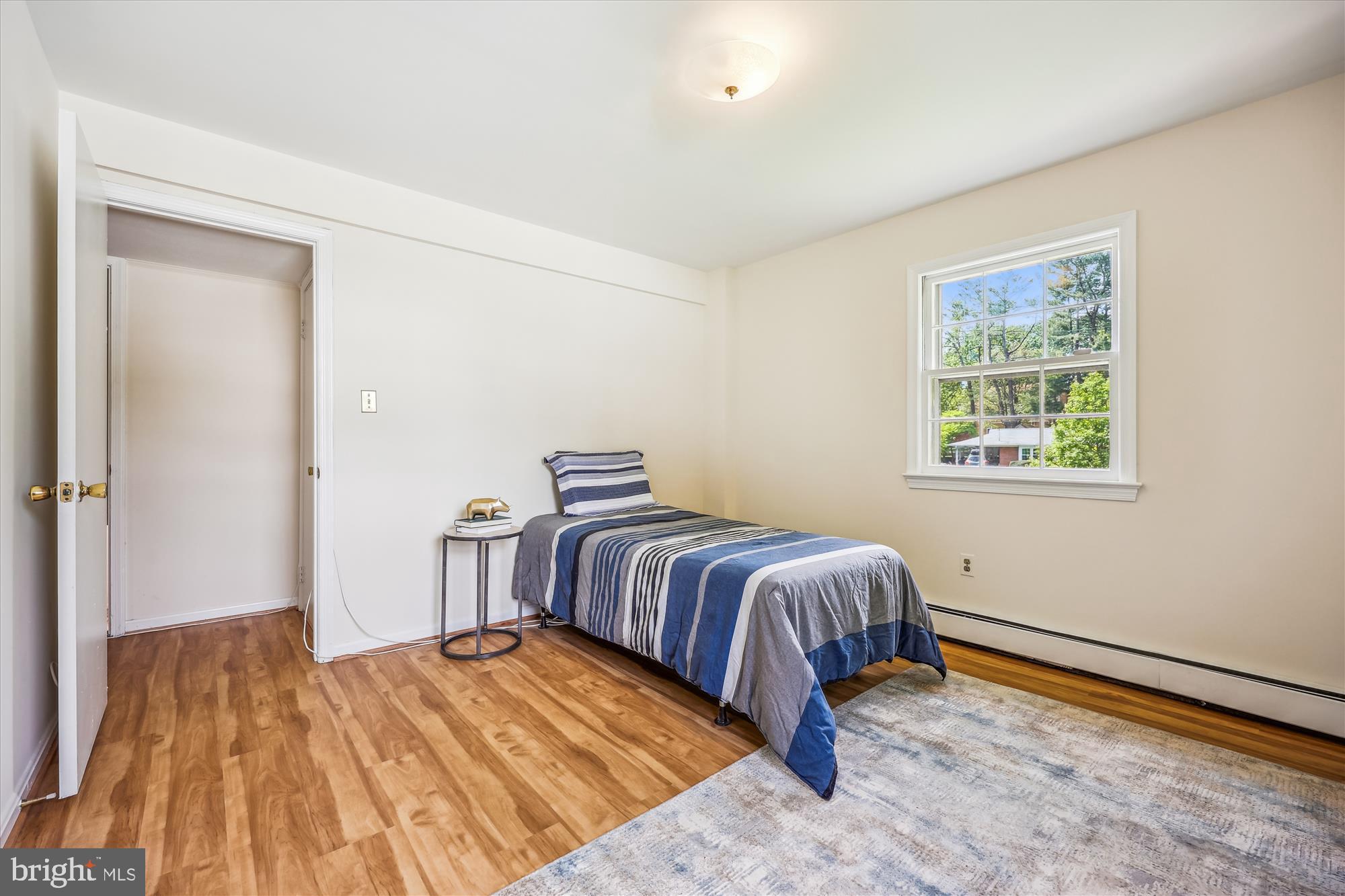 1029 Tracy Drive Silver Spring, MD 20904 - Photo 30 of 59 a bedroom with a bed and wooden floor