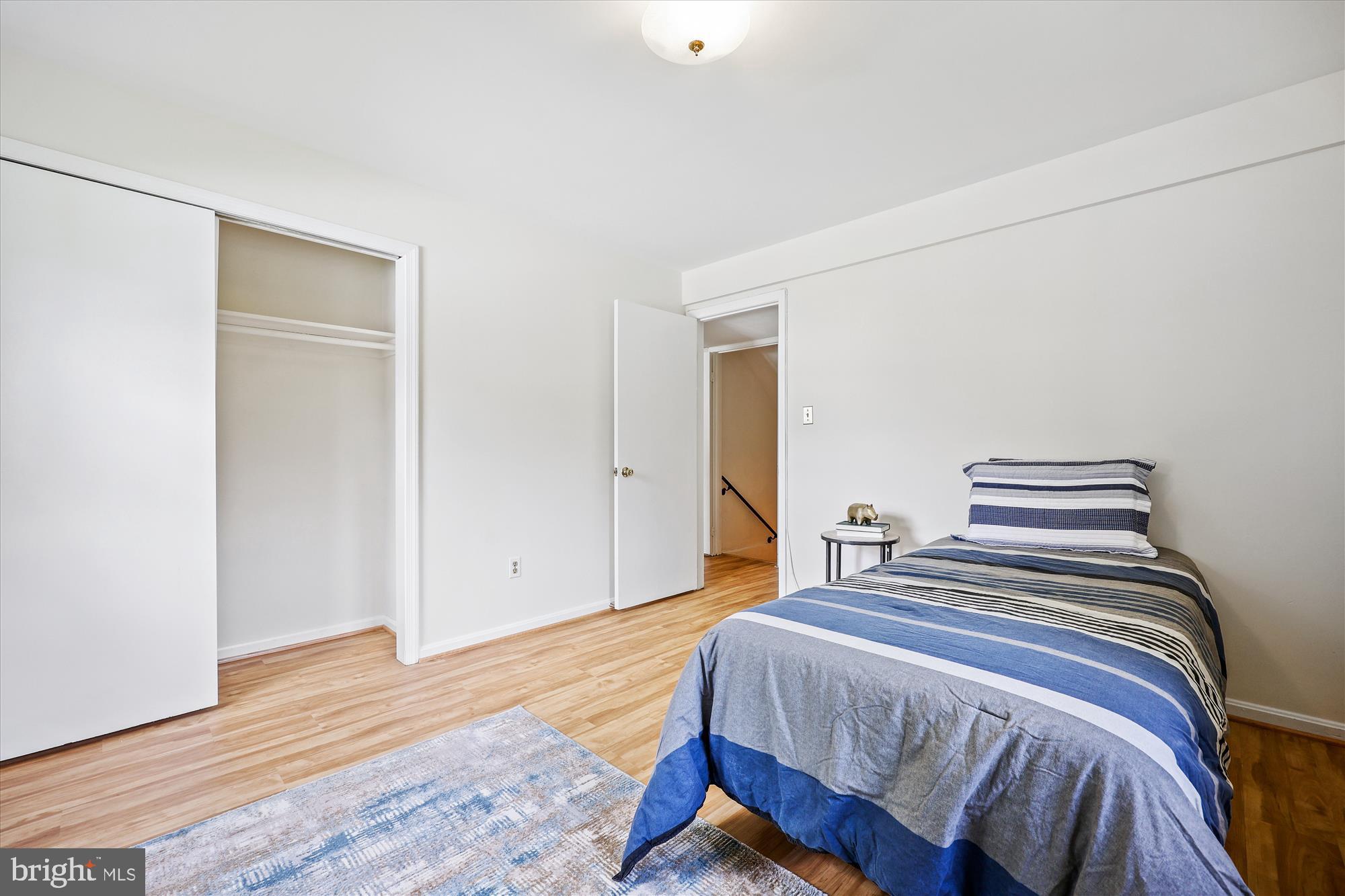 1029 Tracy Drive Silver Spring, MD 20904 - Photo 31 of 59 a bedroom with a bed and wooden floor